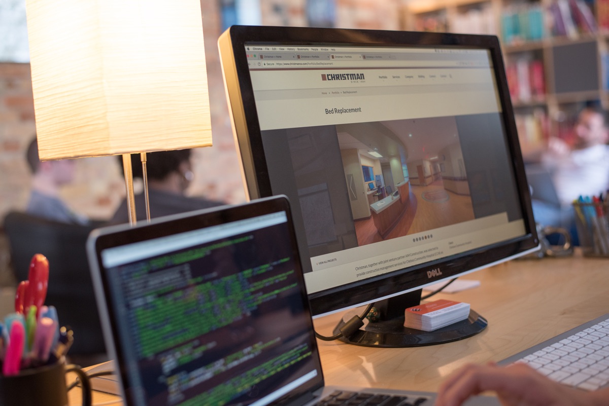 The Christman Company website on multiple monitors