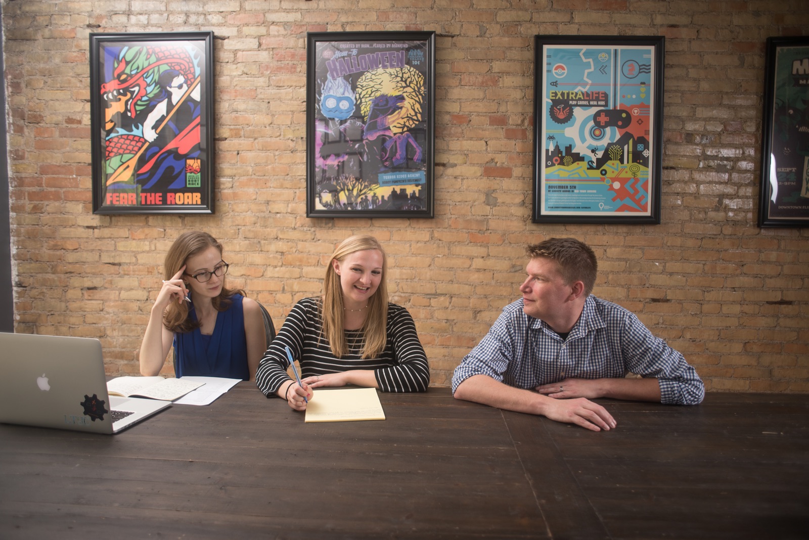 Gravity Works employees Lauren, Hailey, and Jeff working together